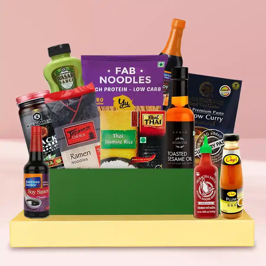 Asian Fusion Delight Gift Set featuring L Exclusive Oyster Sauce, Japanese Ramen, Real Thai Jasmine Rice, and Flying Goose Sriracha arranged beautifully in a gift box.