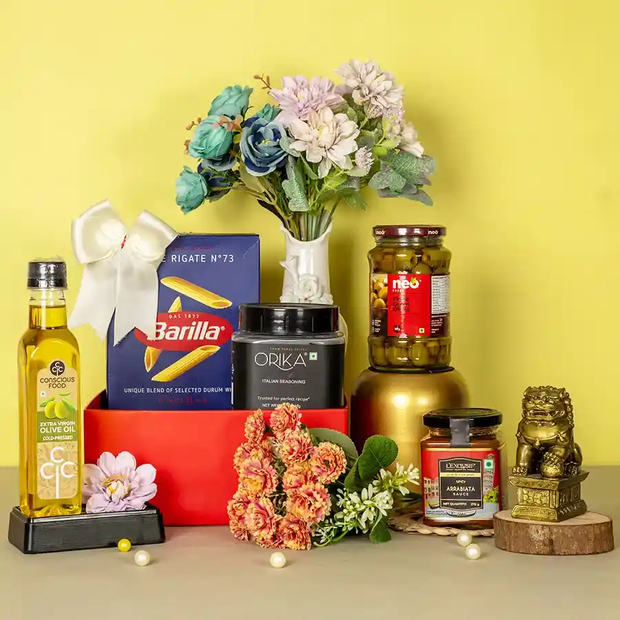 Gourmet Pasta N Sauce Delight Hamper featuring Barilla Penne Pasta, LExclusif Arrabiata Sauce, Neo Pitted Olives, Conscious Food Olive Oil, and Orika Italian Seasoning arranged in an elegant presentation.
