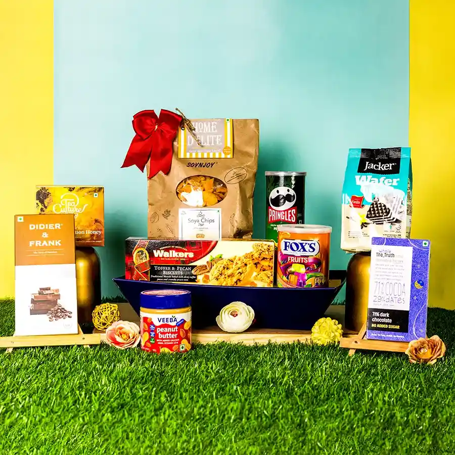 Decadent Snacks N Chocolates Treat Hamper featuring peanut butter, biscuits, soya chips, Pringles, dark chocolates, wafers, tea, and fruit candies