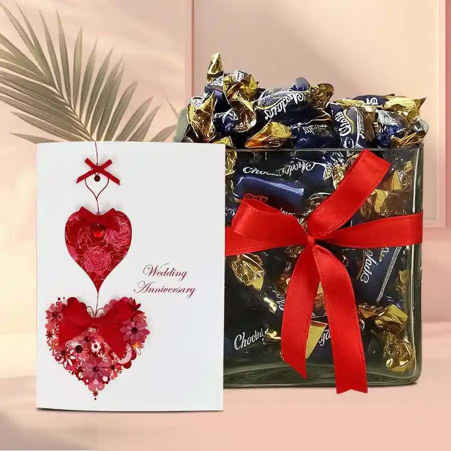 Luxury Trio Anniversary Gift Hamper featuring Eclairs Chocolates in a stylish glass vase and a heartfelt Anniversary Card.