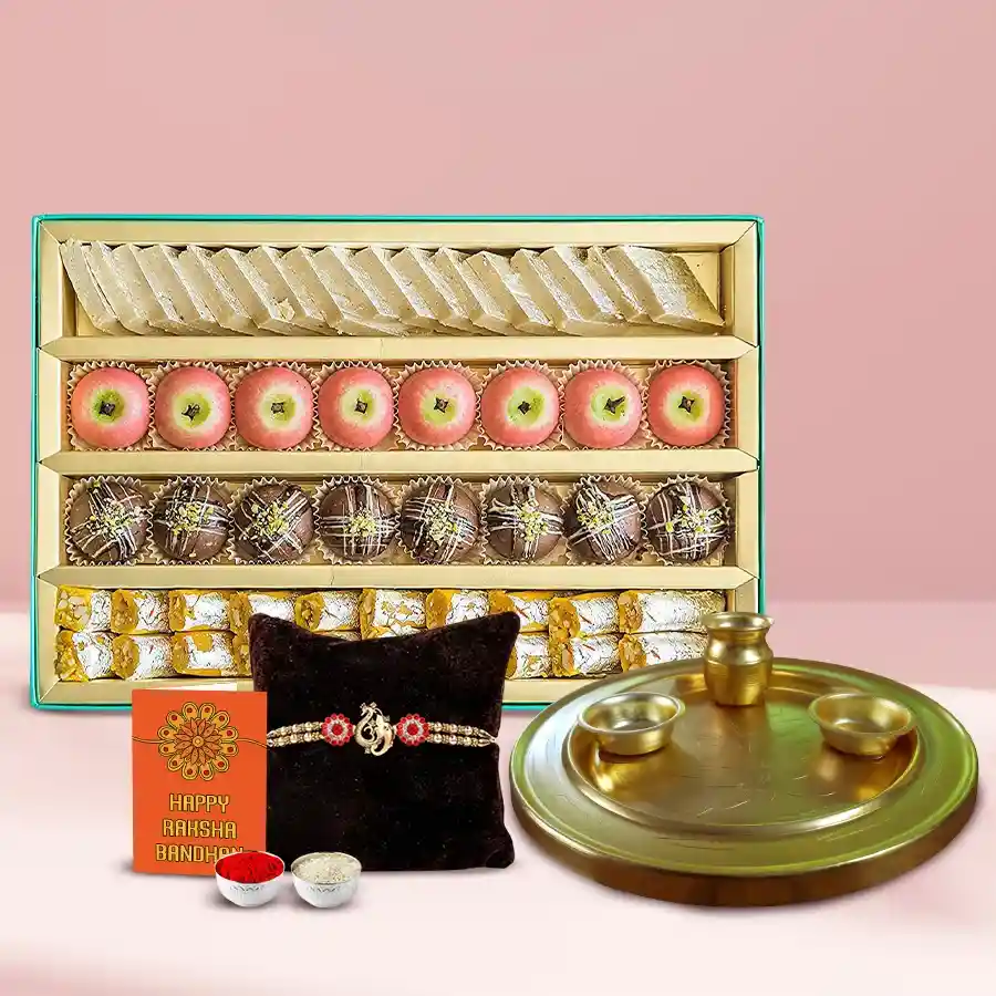 Impressive Ganesh Rakhi set with golden thali, sweets, and traditional pooja items for Raksha Bandhan celebration