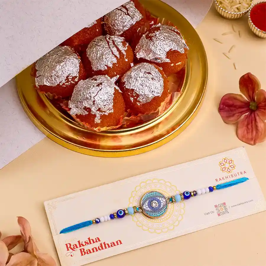 Stylish Evil Eye Rakhi with Ghee Laddus in a festive setting