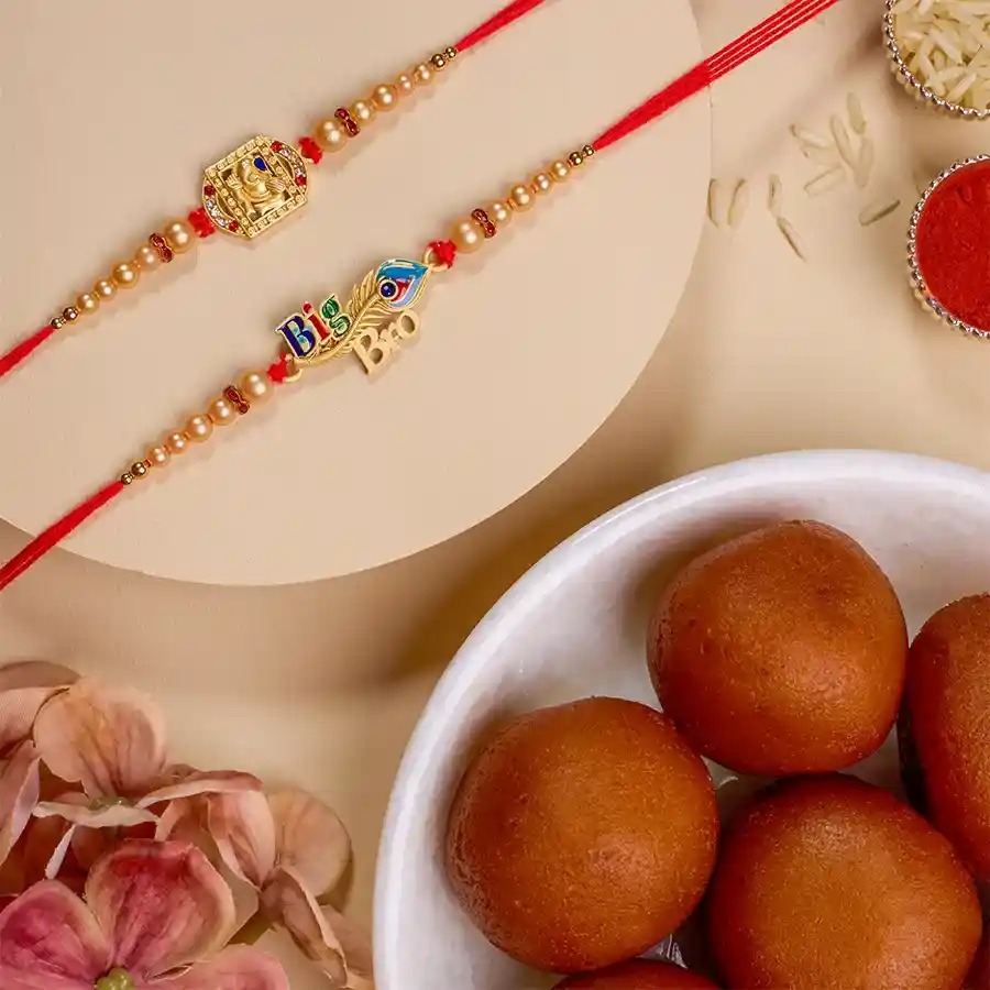 Sacred Bonds Rakhi Combo featuring two Rakhis with Lord Ganesha and Lord Krishna, a box of 500g Gulab Jamun, Roli Tika, Chawal, a personalized message card, and a free Rakhi.