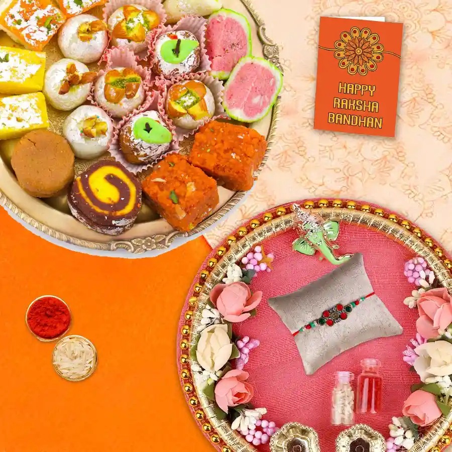Tasty Haldiram Mixed Sweets in a Designer Rakhi Thali with a beautiful rakhi, roli, tilak, and chawal