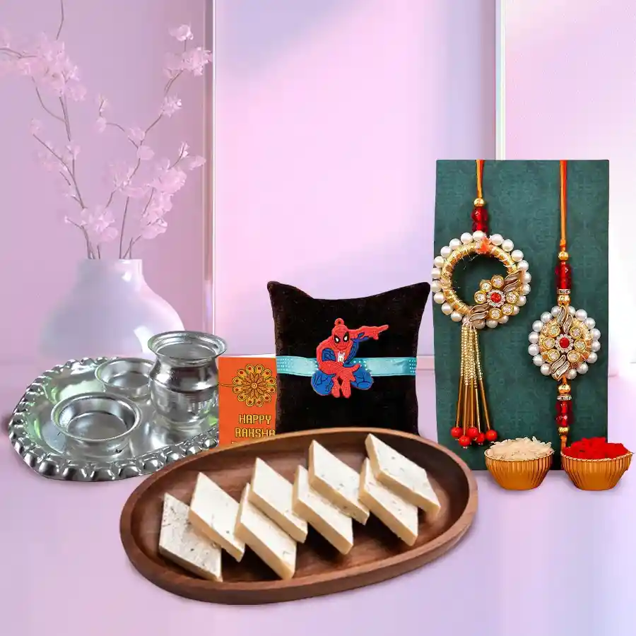 Holy Puja Aarti Thali with Kaju Katli, Rakhis, Roli Tilak, and Chawal for Raksha Bandhan celebration