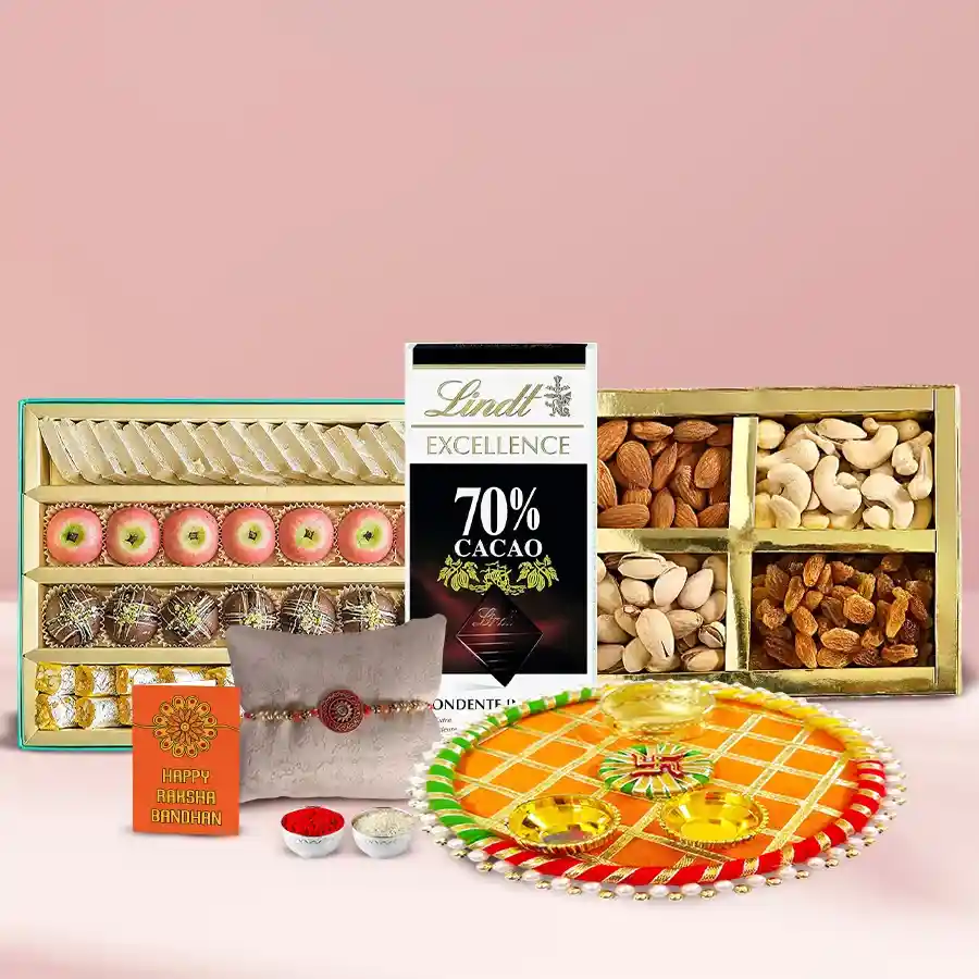 Rakhi gift pack featuring Lindt chocolates, mixed dry fruits, Haldiram Mithai, a traditional Delhi Thali, and a beautiful stone Rakhi