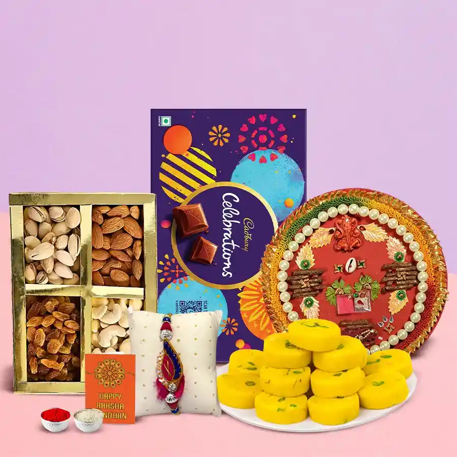 Yummy Cadbury Celebration hamper with mixed dry fruits, Haldiram Kesar Peda, Zardoji Rakhi, and decorative Shree Thali for Raksha Bandhan celebration