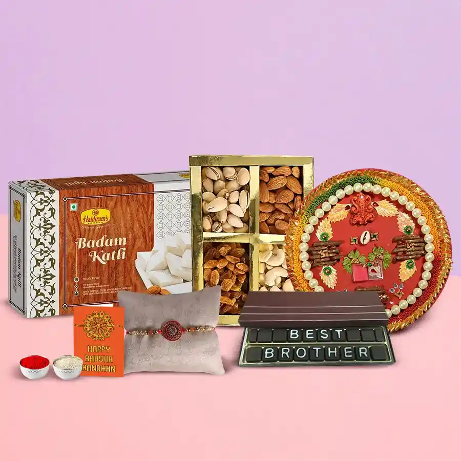 Gift bundle for Raksha Bandhan featuring Haldirams Badam Barfi, mixed dry fruits, homemade chocolates, Shree Thali, and a free stone Rakhi with Roli, Tilak, and Chawal.