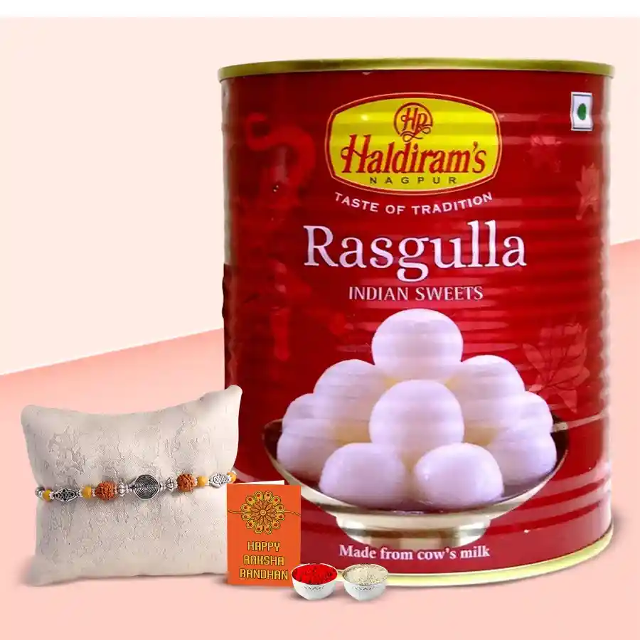 Potent Rakhi Adornment featuring a 1 kg pack of Haldiram Rasgulla, a stylish designer Rakhi, and a complimentary Auspicious Roli Tika and Chawal, beautifully arranged for Raksha Bandhan celebrations.