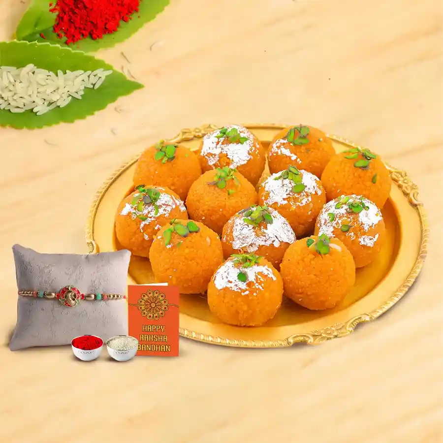Haldiram Pure Ghee Ladoo pack with decorative Rakhi, Roli Tilak, and Chawal for Raksha Bandhan celebration