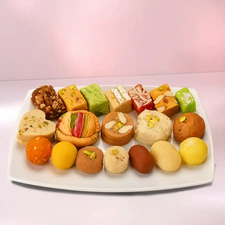 Haldirams Mixed Sweets Platter ½ Kg assortment featuring a variety of traditional Indian sweets arranged beautifully.