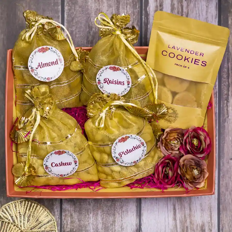 Heavenly Nut Lovers Gift Pack featuring premium almonds, cashews, pistachios, raisins in potlis, lavender cookies, and a stylish reusable designer tray