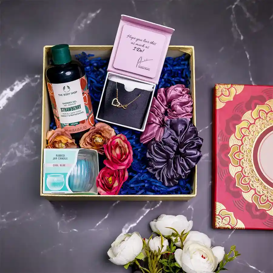 Serenity N Style Gift Box featuring a silver rose gold infinity necklace, strawberry shower gel, two satin scrunchies, and an Irish ribbed jar candle in a reusable mandala designer box.