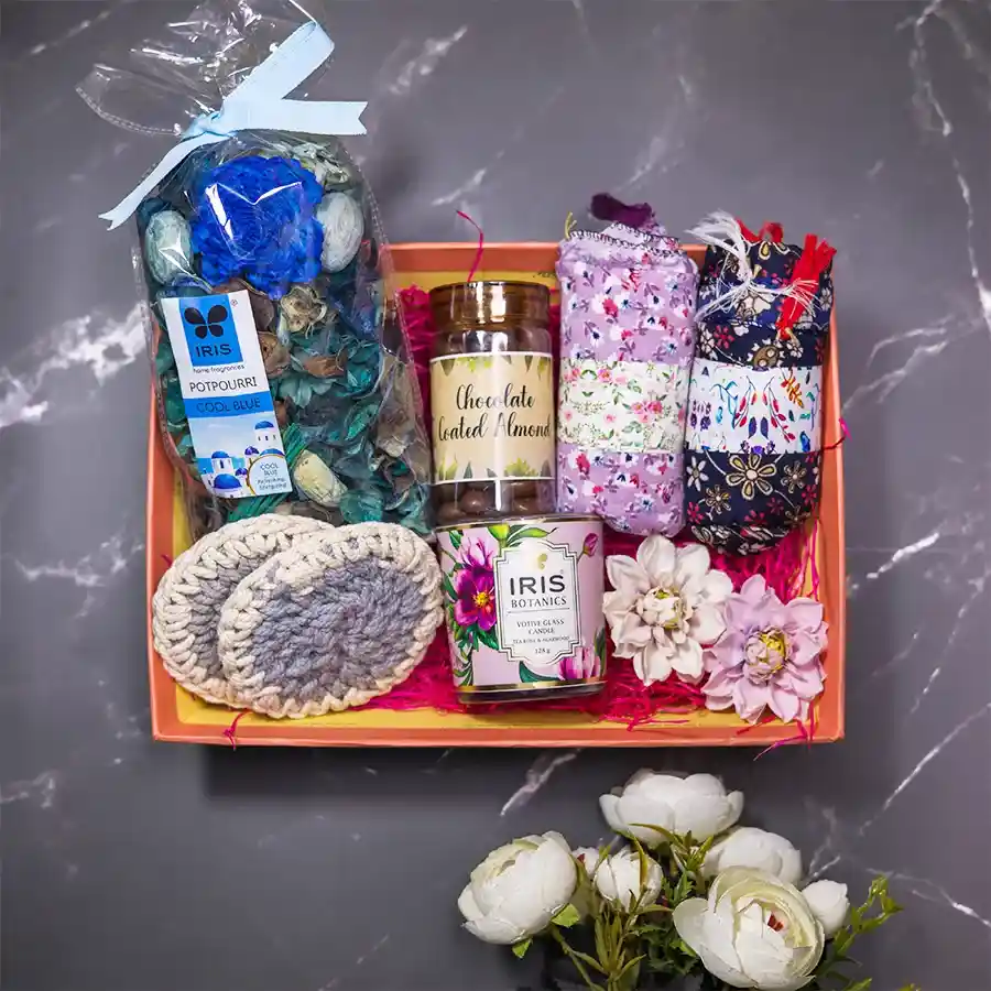 Serene Indulgence Gift Set featuring potpourri, scented candle, chocolate-coated almonds, cotton scarves, and tea coasters in a designer tray.