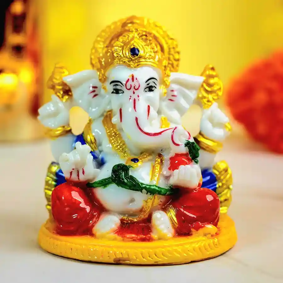 Tranquil Marble Abhaya Mudra Ganesha statue with intricate details and polished finish, symbolizing fearlessness and protection, set against a neutral background.