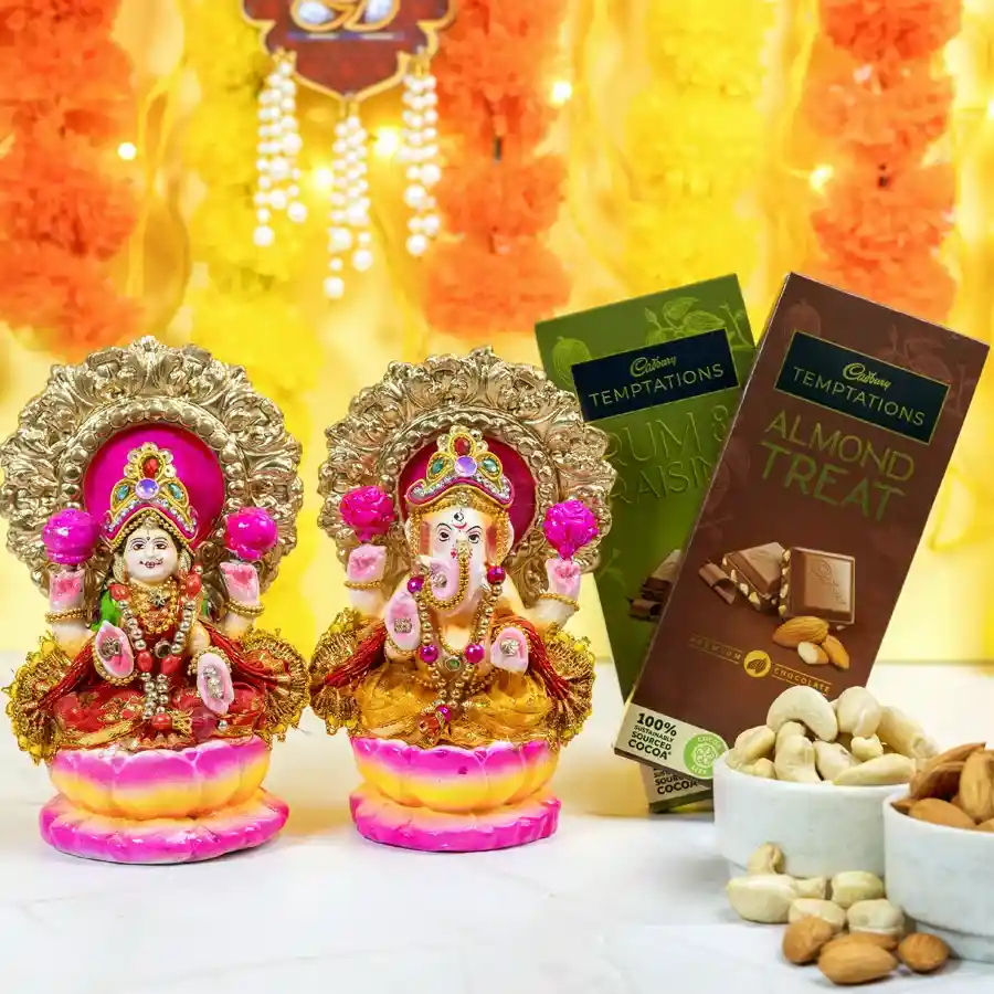 Spiritual Laxmi Ganesh murtis with Cadbury Temptations chocolates, almonds, and cashews in an elegant gift packaging