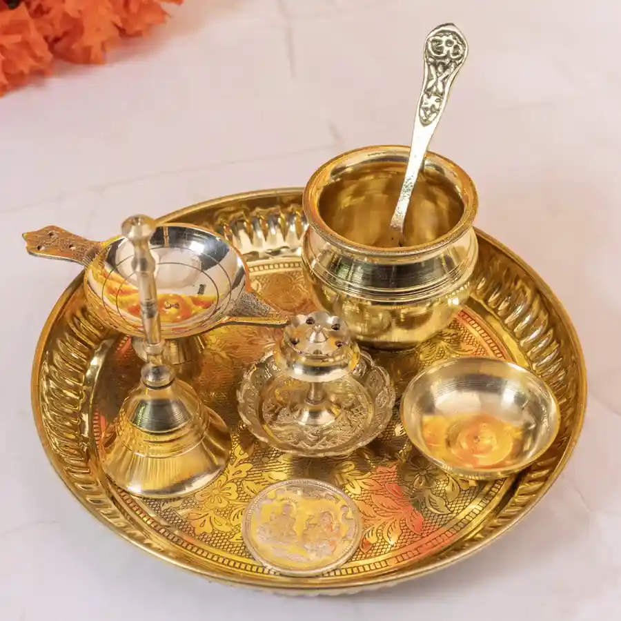 Divine Pooja Thali Gift Set featuring a brass Kalash, spoon, ghanti, agarbatti stand, diya, chandan katori, and a silver-plated Laxmi Ganesh coin