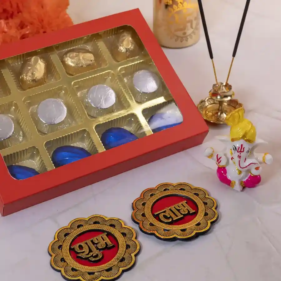 Festive Blessings Gift Set featuring homemade chocolates, a Mukut Ganesh figurine, and a Subh Labh sticker, arranged in a festive presentation.