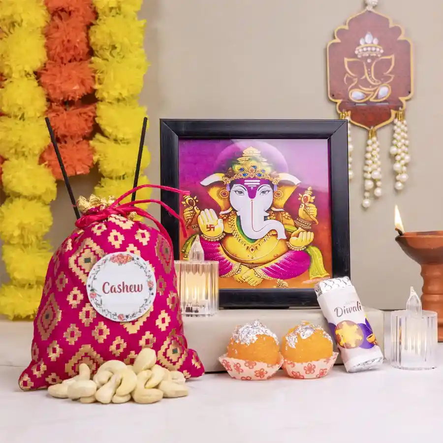 Ganesha Art with Sweets and Candles Set featuring a vibrant wall painting, cashew potli, homemade chocolate bar, LED tea lights, and Laddu candles.