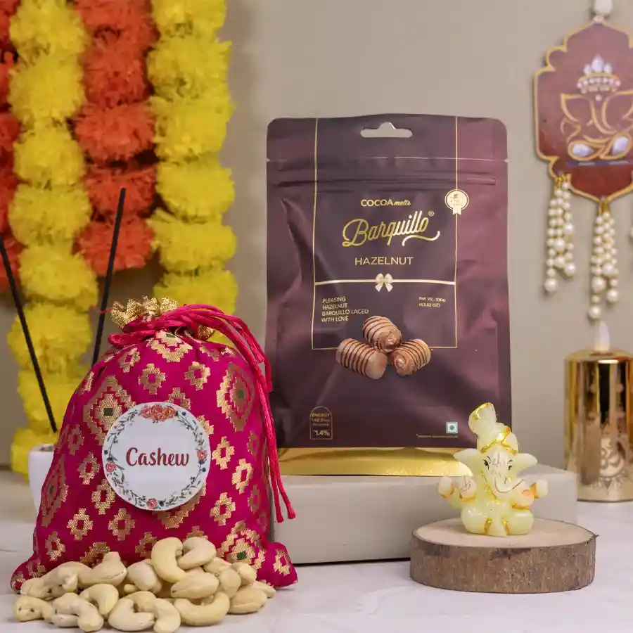Flavorful Treats N Ganesha Blessing Set featuring Barquillo Hazelnut Chocolate, Cashew Potli, and a Glowing Ganesh figurine arranged beautifully in a festive setting