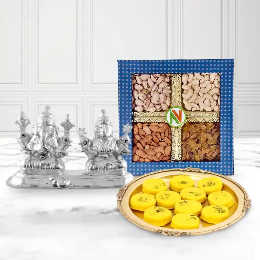 Marvelous Sweets and Dry Fruits Combo for Bhai Dooj featuring Silver Plated Ganesh Lakshmi Idol, 250g dry fruits, 500g Kesaria Peda, and complimentary Roli, Tika, and Chawal.