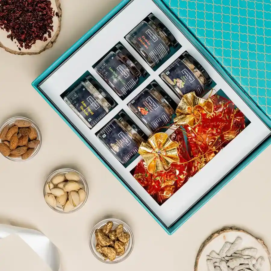 Tasty Chocolaty Bites and Assorted Mukhwas with Dried Fruits Gift Box arranged elegantly