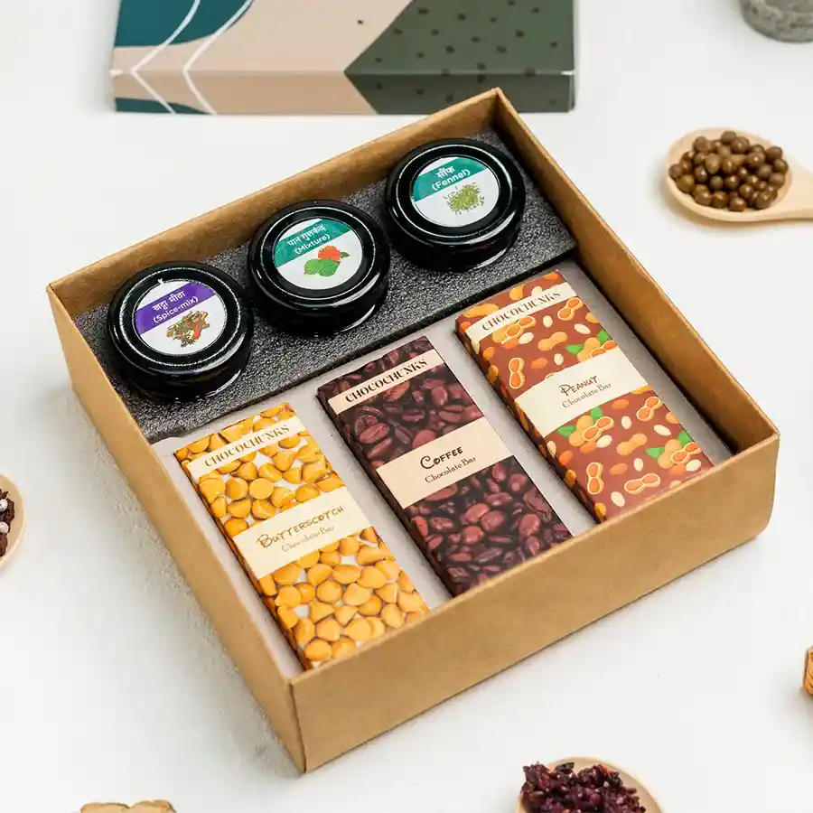 Assorted Mukhwas and chocolate gift box featuring Khatta Meetha Goli, Paan Gulkand, Saunf Churi, Butterscotch, Coffee, and Peanut chocolate bars