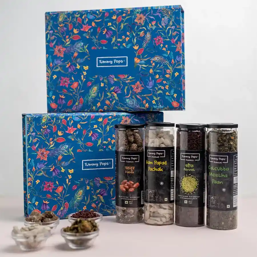 Assorted Mukhwas gift pack featuring sweet Khajoor, tangy Aam Papad Pachak, refreshing Saunf, and Calcutta Meetha Paan