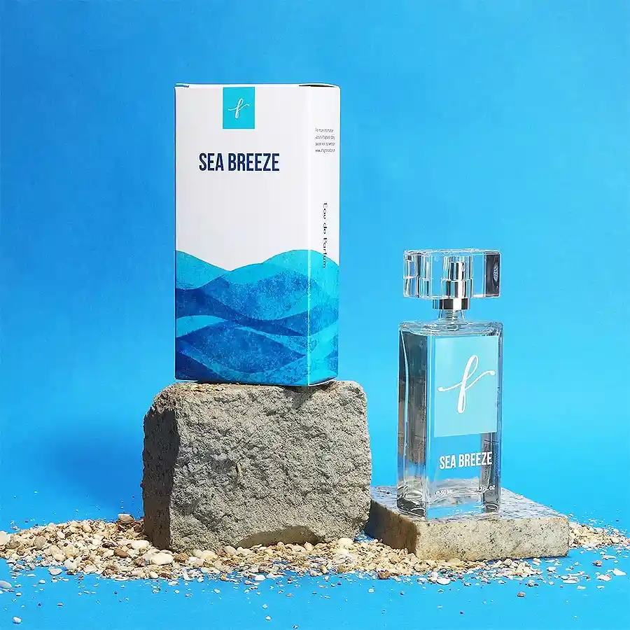 Oceanic Bliss Scent of Summer Smiles perfume bottle with vibrant beach-themed background