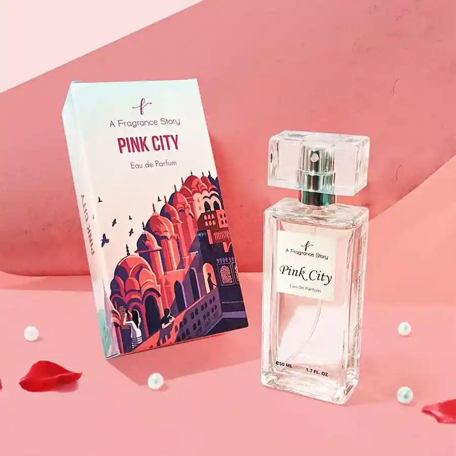 Elegant perfume bottle of Pink City Perfume Majestic Warmth of Jaipur against a backdrop inspired by the colors and textures of Jaipur.