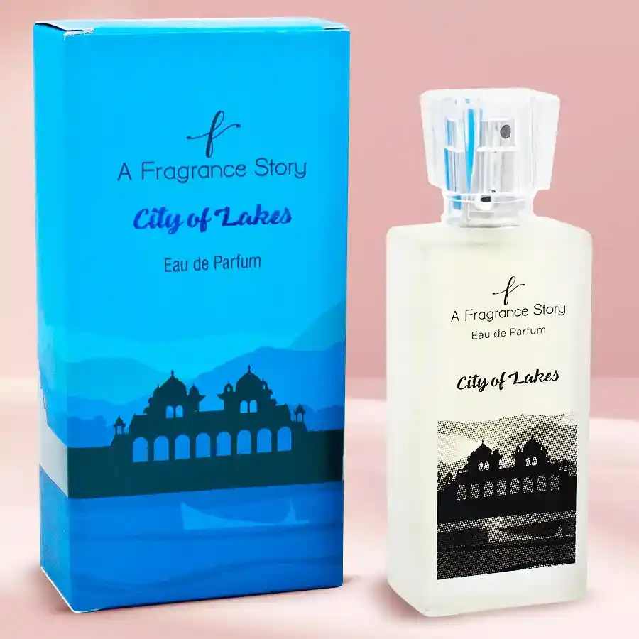City of Lakes Perfume Fresh Oriental Passion bottle surrounded by fresh fruits and floral decorations, evoking vibrant and romantic scents.