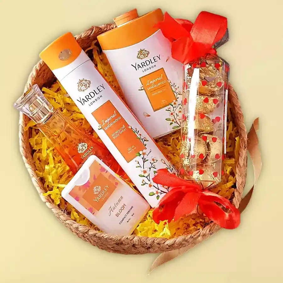 Yardley London grooming hamper featuring body spray, perfumed talc, compact perfume, cologne spray, homemade toffees, and a reusable basket