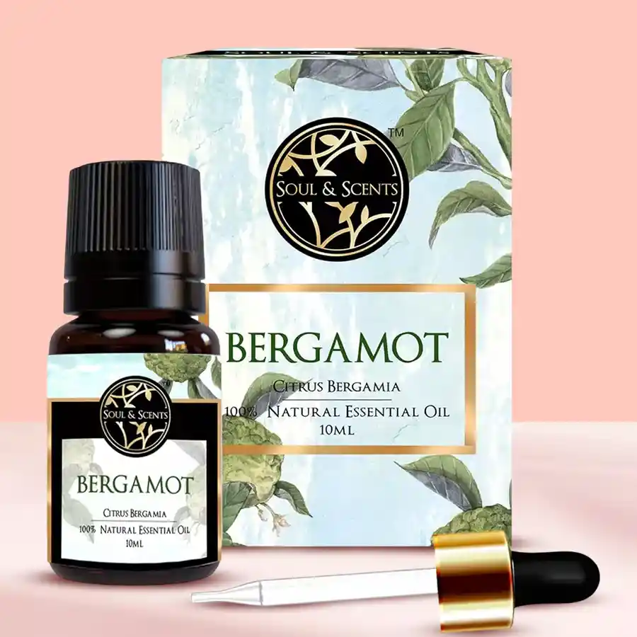 Bottle of Refreshing Bergamot Essential Oil with a citrus and floral background