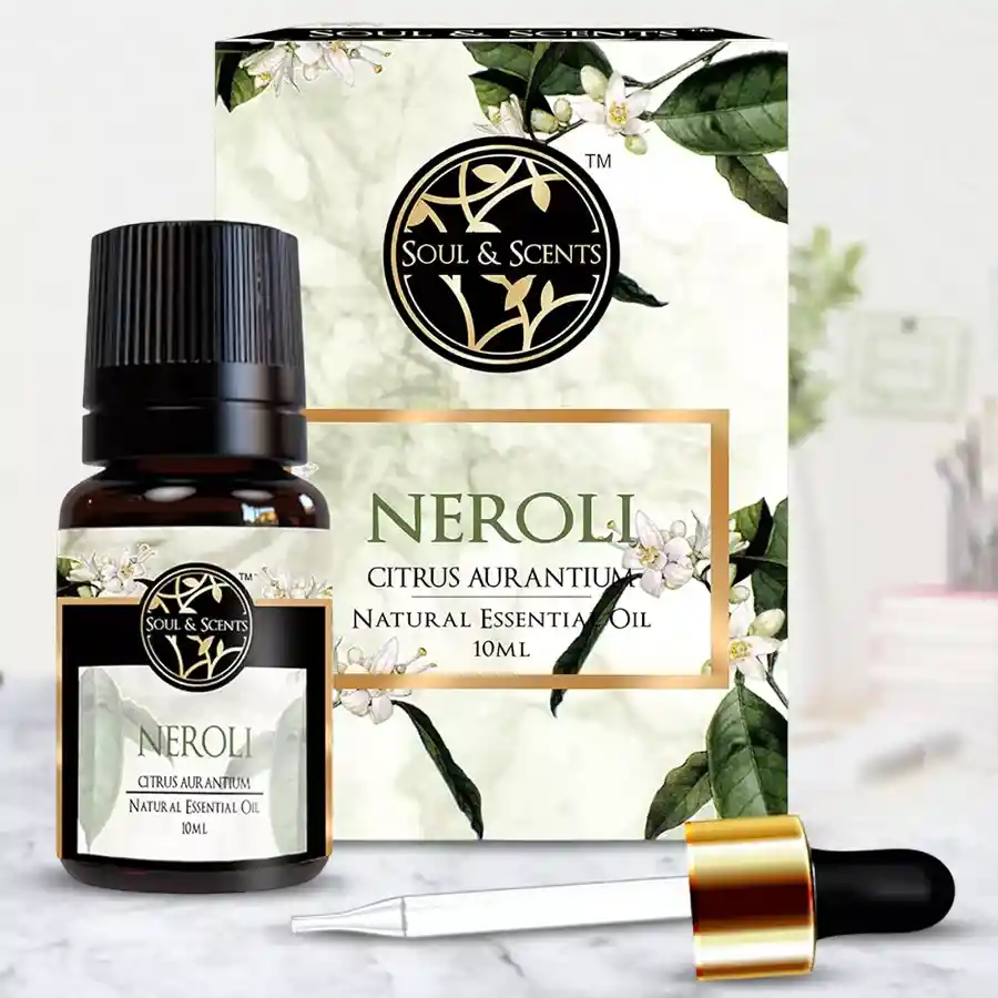 Bottle of Essence of Tranquillity Neroli Essential Oil with a floral background