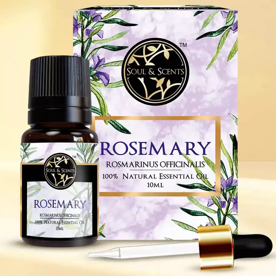 Rejuvenating Rosemary Essential Oil bottle with fresh rosemary sprigs and a wooden surface