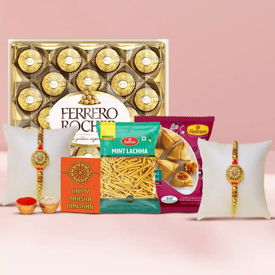 Trendy Twin Golden Rakhi gift pack featuring two golden rakhis, Ferrero Rocher chocolates, Mint Lachha, Mini Samosas, Roli Tilak, Chawal, and a personalized Rakhi card.