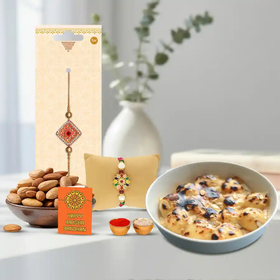 Baked Rasgullas, crunchy almonds, and an ethnic Rakhi set arranged in a festive display with a message card, Roli Tilak, and Chawal