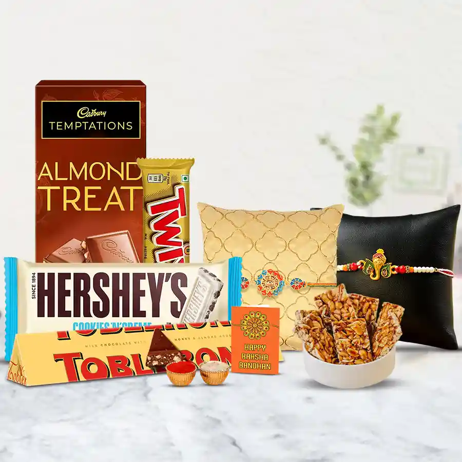 Designer Rakhi set with sweets, savory treats, and assorted chocolates hamper for Raksha Bandhan celebration