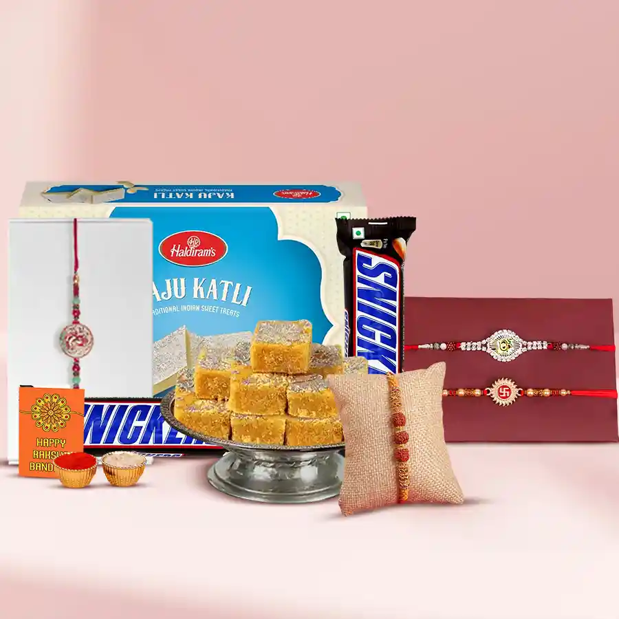 Set of 4 colorful rakhis with Haldiram sweets, including Kaju Katli and chocolates, accompanied by a greeting card and Roli Chawal tika.