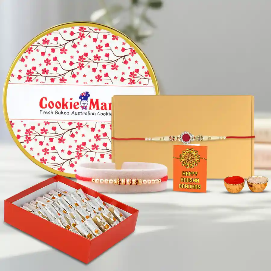 Traditional Haldiram Kaju Pista Basket with Cookie Mans Cookies N Twin Rakhi gift set, featuring sweets, cookies, a pearl Rakhi, and traditional puja items.