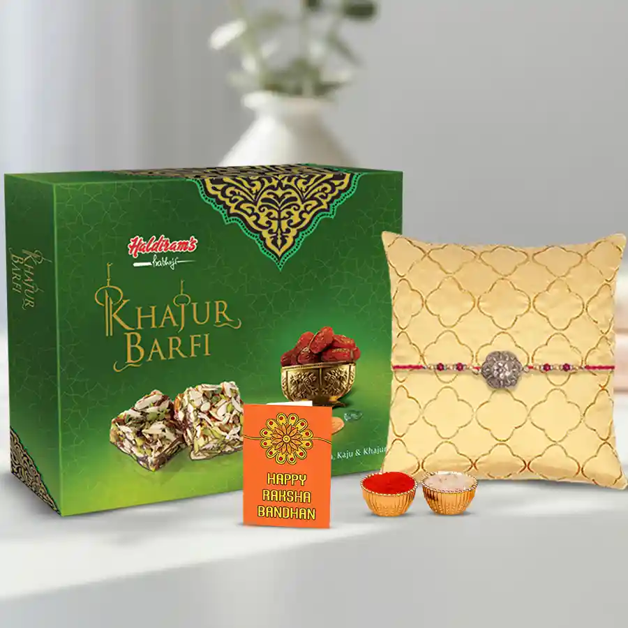 Trendy Rakhi bundle with Haldiram Khajur Pista Delight, Roli Tilak, Chawal, and a beautiful Rakhi Card