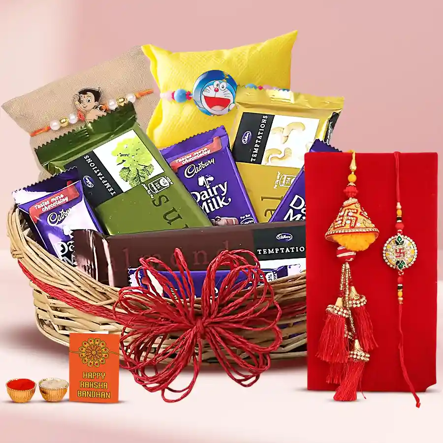 Chocolaty Treat n Family Rakhi Set with cane basket filled with Cadbury Dairy Milk bars, Cadbury Temptations chocolates, and decorative Rakhis, Roli, Tika, and Chawal.