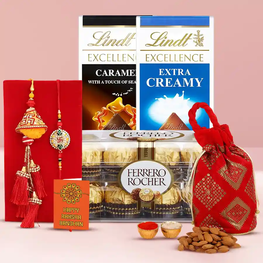 Rakhi gift set featuring Lindt Excellence bars, Ferrero Rocher chocolates, an almond potli, a Rakhi set, and Roli, Tika, and Chawal for Raksha Bandhan celebration.