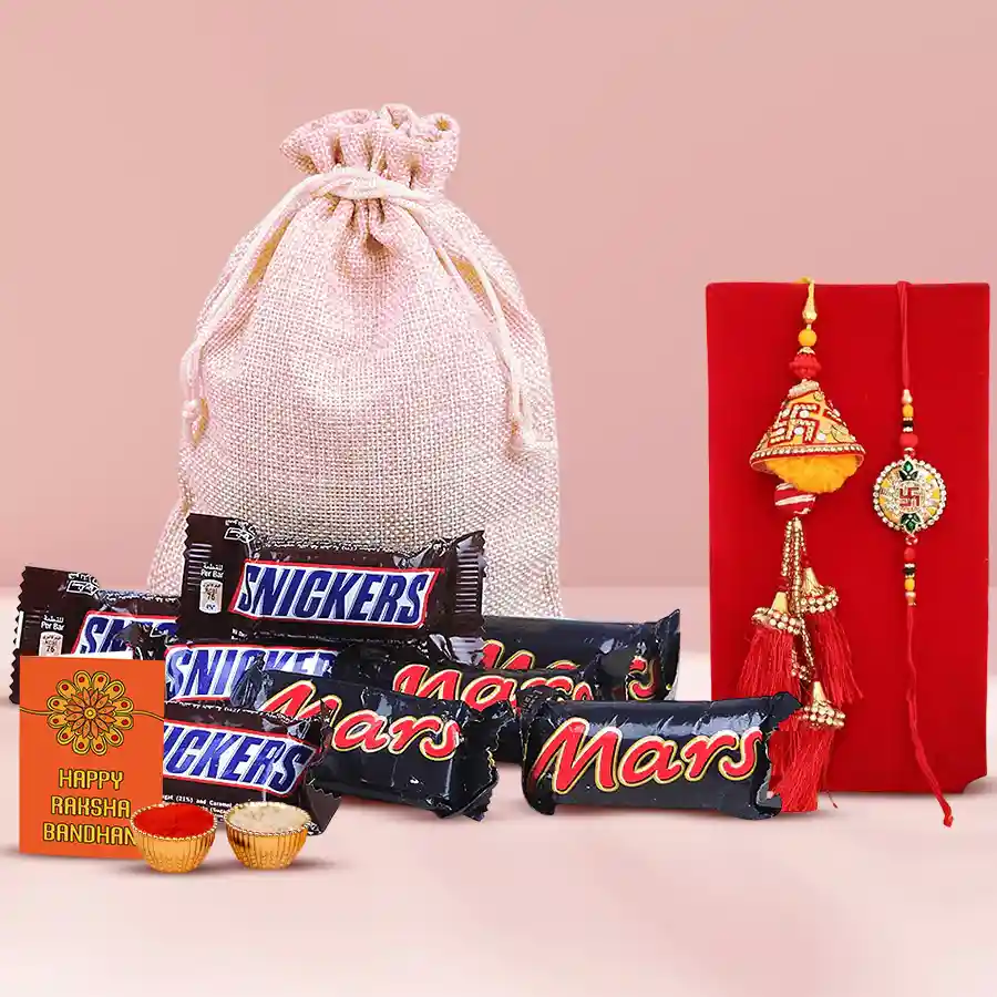 Cool Rakhi Chocolates for Bhai-bhabhi featuring Snickers, Mars bars, a stylish Rakhi set, and traditional Roli, Tika, and Chawal in an eco-friendly jute bag.