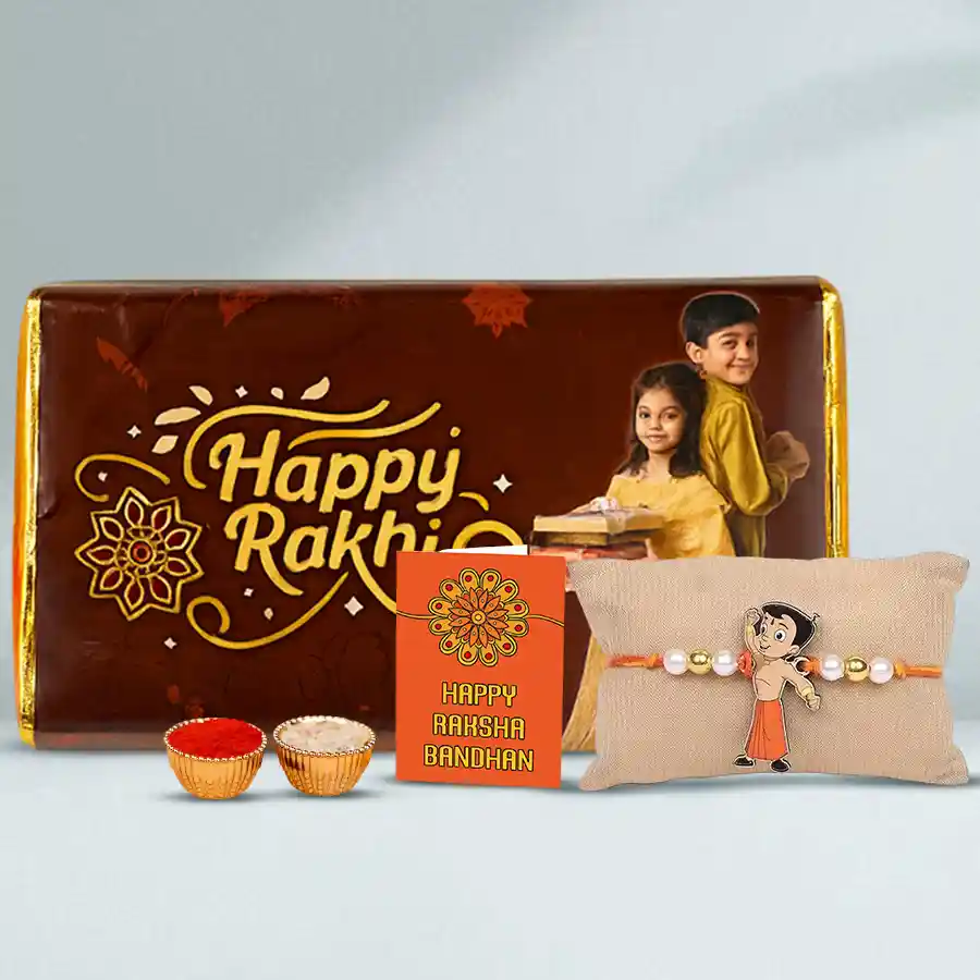Chota Bheem Rakhi alongside a personalized Cadbury Crispello chocolate bar, with traditional Raksha Bandhan essentials like Roli, Tika, and Chawal arranged attractively.