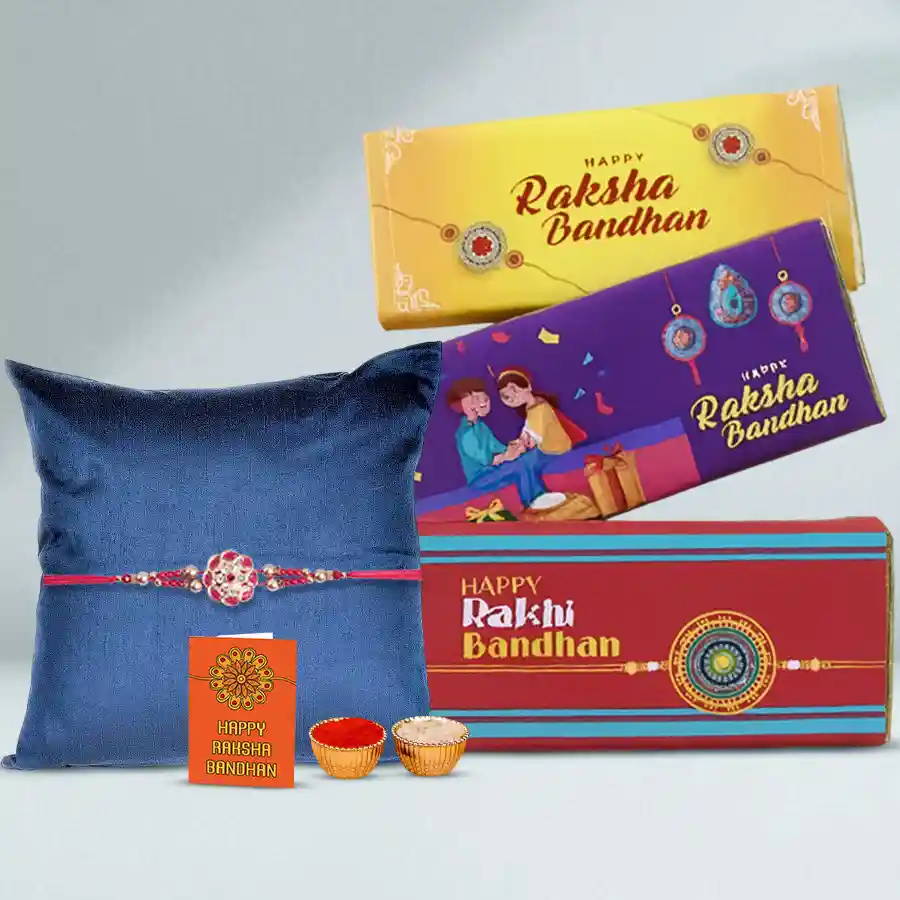 Rakhi gift set featuring Nestle Kit Kat Dessert Delight, a beautiful Rakhi, a Rakhi card, and traditional roli, tika, and chawal.