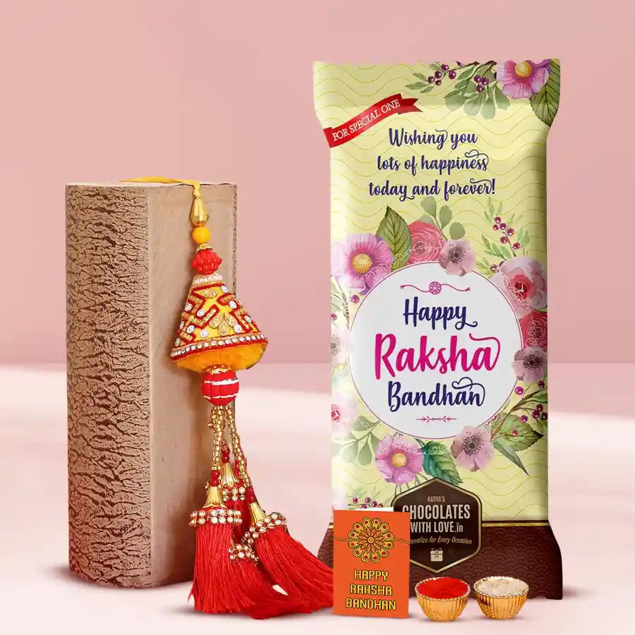 Personalized Chocolate Delight gift bundle for Raksha Bandhan featuring a customized Cadbury Dairy Milk Fruit & Nut bar, a premium Lumba Rakhi, a free Rakhi, Roli, Tika, and Chawal.