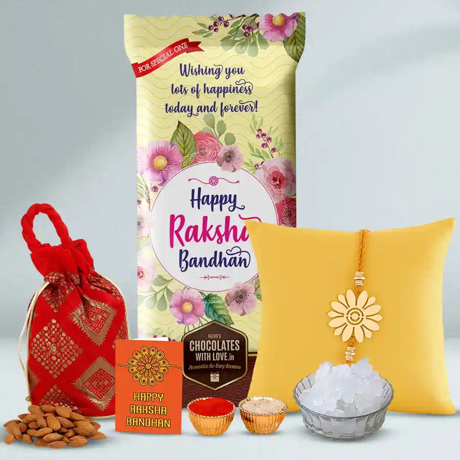 Metal Rakhi Bonanza with personalized chocolate treats, including a sleek metal rakhi and a Cadbury Dairy Milk Roast Almond chocolate bar in an almond potli, accompanied by traditional Rakhi essentials.