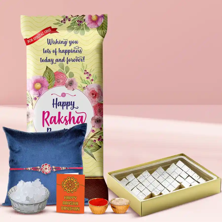 Personalized Chocolate Rush gift box featuring Cadbury Dairy Milk Roast Almond Chocolate, Kaju Katli, a stylish Rakhi, Roli, Tilak, Chawal, and Mishri for Raksha Bandhan celebration.