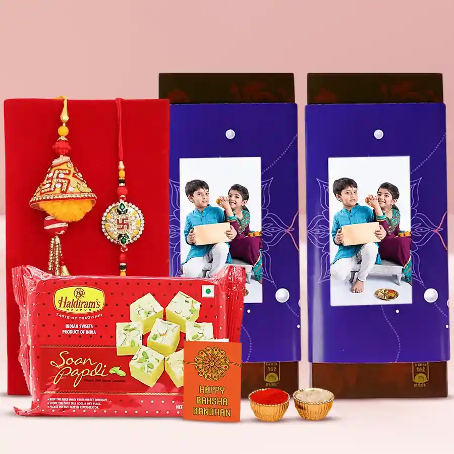 Personalized Choco Magic gift box featuring Cadbury Temptation Almond Chocolate Bars, Haldiram Soan Papdi, Bhaiya Bhabhi Rakhi Set, and complimentary Rakhi, Roli, Tilak, and Chawal.